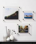 Top Tier Eight Pack Standoff Mounts Three Quarter By One Inch Brushed Stainless Steel Wall Brackets holding three photos.
