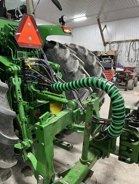 Hydraulic Hose Management Protector And Tagging Wrap For Farming And Agricultural Gear Tractors Harvesters Planters And Sprayers Green 4 Foot Heavy Duty Hose Bundle Shield Keeps Your Hoses Safe And Organized installed on green tractor