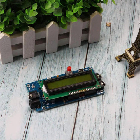 Ham Radio Essential CW Decoder Morse Code Reader And Translator with LCD display and plug and play setup on a wooden surface.