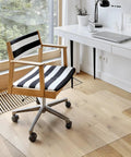 Clear Office Chair Mat 36x48 Inches With Lip Heavy Duty PVC Floor Protector beneath rolling chair on hardwood floor.