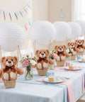 Six Set Large Hot Air Balloon Centerpiece Kit With 13.7 Inch Plush Bears White Paper Lantern Baskets on party table.