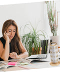 Woman studying at desk with Bang For Your Buck Usb Power Strip With Heavy Duty Ac Outlets And Rapid Charge Ports.