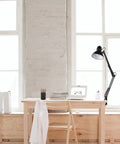 32 Inch Swing Arm Clamp On Desk Lamp Black Finish With LED Bulb Included mounted on desk in bright room