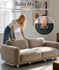 Woman using Total 1100 Pound Capacity Heavy Duty Moving Dollies Two Pack with sofa on plywood platform and TPR wheels in living room.
