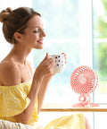 Woman enjoying coffee with USB Desk Fan With CVT Variable Speeds, Portable Mini Personal Fan For Home Office Bedroom on the table