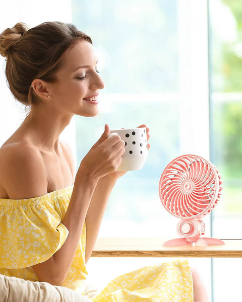 Woman enjoying coffee with USB Desk Fan With CVT Variable Speeds, Portable Mini Personal Fan For Home Office Bedroom on the table