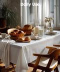 No Sweat Heavy Duty Disposable Tablecloths White 8 Pack 54 By 108 Inches on table set for daily use with food and drinks.