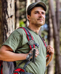 Hiker with Heavy Duty Retractable Keychain Badge Reel With Carabiner And 31.5 Inch Dyneema Cord on backpack