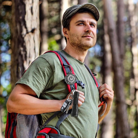 Hiker with Heavy Duty Retractable Keychain Badge Reel With Carabiner And 31.5 Inch Dyneema Cord on backpack