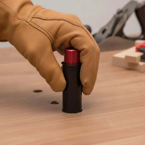 Hand in glove adjusting Retractable Table Stop For Woodworking, Matte Black Bench Stop on a wooden surface