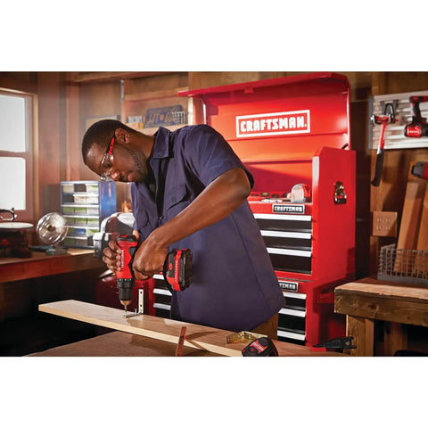 Person using V20 Cordless Drill And Driver Kit With One Half Inch Chuck Battery And Charger Included High Output 320 Watts