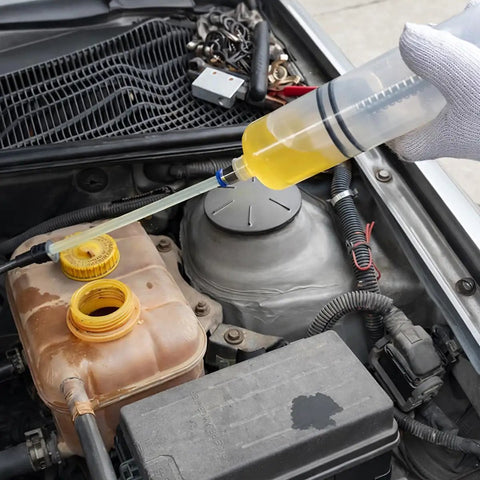 No Fuss Heavy Duty 500cc Car Fluid Extractor Pump With Flexible Hose draining fluid from a car engine's reservoir.