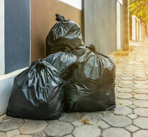 Heavy Duty 55 Gallon Contractor Trash Bags 3 Mil Thick Black Liners With Ties, 50 Bags For Construction And Industrial Use on sidewalk