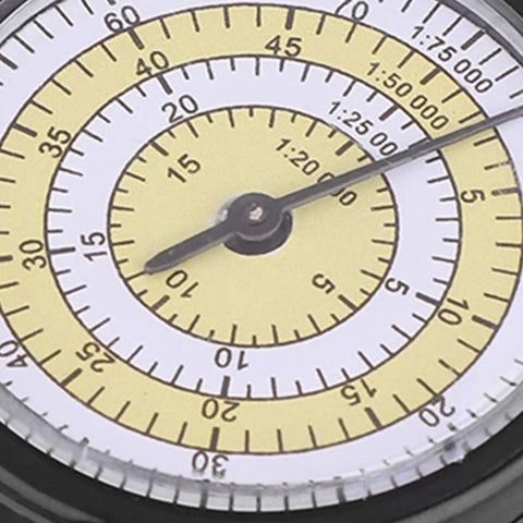 Close-up of Chrees Map Measuring Gauge with yellow and white scales for accurate distance measurement.