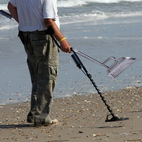 Man on beach using Sand Scoop For Metal Detecting Stainless Steel Beach Treasure Dig Tool With Adjustable Long Handle Pole