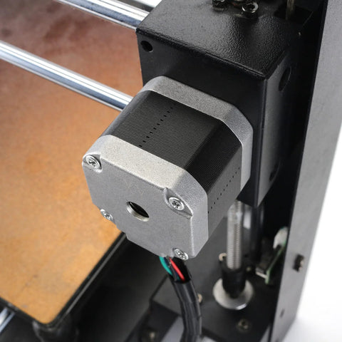 Side view of a NEMA 17 stepper motor extruder mounted on a 3D printer frame with visible wiring.