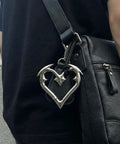 Y2K Heart Carabiner Keychain With Cute Star Clip attached to a black bag, showing durable metal goth style, trendy accessory.