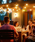 Outdoor String Lights Waterproof 240Ft With 124 G40 Globe Bulbs And 4 Spares Connectable Dimmable LED Patio Lights hanging over a patio gathering.