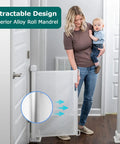 Retractable Baby Gate For Stairs And Doorways, Extra Wide Mesh Barrier Extends Up To 71 Inches, 33 Inches Tall, woman holding baby