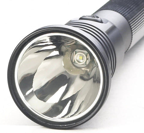 Close-up of the lens and LED bulb of an 800 Lumen Rechargeable LED Flashlight With Dual Switches, 438 Meter Beam, Black.
