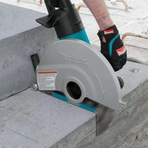 14 Inch Electric Angle Cutter Powered By A Rugged Fifteen Amp Motor And Smart Slip Clutch Design To Save Your Gears cutting through concrete block.