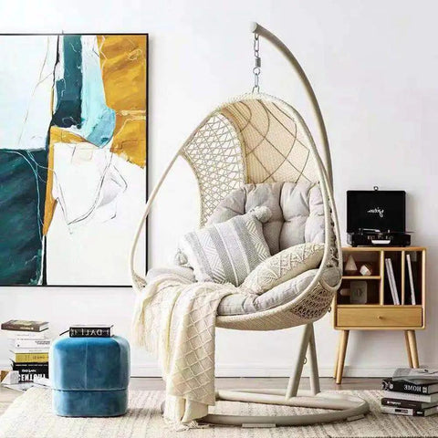 Beefy Heavy Duty Spring Hammock Chair With 700Lb Capacity Suspension Swing Hanger For Porch Patio And Garden Fits Almost All Hammock Chairs And Swing Benches Galvanized Steel Coil with cushions in a living room setting.