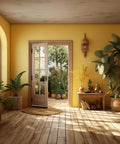 Bright room with plants and an open door leading to a sunny garden.