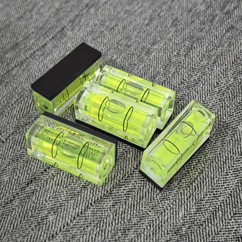 Top Tier 5 Piece Set Of Mini Magnetic Bubble Levels showing bright green acrylic levels with strong adhesion for layout marks.