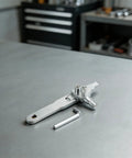 Heavy Duty Stainless Steel Broken Wire Extractor Kit To Yank Out Stripped Screws And Fix Damaged Taps At Home Plumbing Repairs With Adjustable Two Screw Design For Angle Valves Plus Silver Finish For Serious DIY Heroes on gray workbench