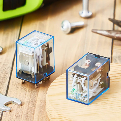 Four Pack DC 12V General Purpose Relays, 8 Pin DPDT Electromagnetic Power Relay, 10A, shown on a workbench with tools.