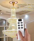 Heavy Duty Electric Chandelier Lift Kit With Remote Controls For Huge Pendant Lights Holds 88 Lbs Capacity remote control in hand.