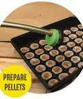 Tray with Seed Starting Greenhouse Kit With 25 Biodegradable Expanding Peat Pellets For Indoor Seedling Start being watered.