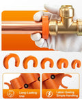 Slick 17 Piece Plumbing Kit With Depth Gauge And Pipe Deburring Tool For Sharkbite Push Fit Fittings Including Steel Blades For Copper Pvc Pex Cpvc Making Pipe Jobs No Sweat, showing a hand holding a copper pipe with orange collars.