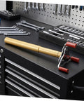 Dead Simple Fire Alarm Removal Tool With Long Extendable Pole on a workbench among tools, featuring rugged grip and golden finish.