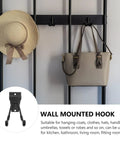 Rock Solid Black Metal Wall Hooks For Bags And Hats With Heavy Duty Mount, supporting a hat and handbag.