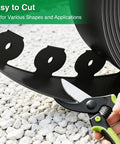 1.5 Inch Landscape Edging Kit With 100 Feet Total No Dig Lawn Border being easily cut with scissors on gravel