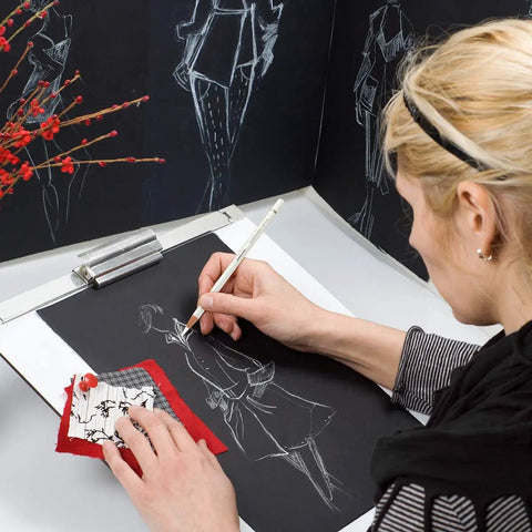 Artist drawing with Three Pack White Charcoal Pencil Set For Drawing Sketching Shading Blending And Highlights On Dark Paper Top Notch Pro Grade Quality For High Contrast Artwork And Easy Light Accents on dark paper
