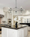 10 Light Modern Sputnik Chandelier In Matte Black With Globe Glass Shades For Dining Room, Kitchen Island, And Living Room, Industrial Chic, Easy Install, Statement Lighting Fixture For Modern Homes above kitchen island
