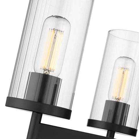 Close-up of Winslett Linear Pendant in Matte Black with slick clear ribbed glass shades for kitchen island and ceiling lighting fixture.