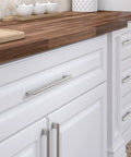 Front view of Avellino Collection Slick Brushed Nickel Cabinet Handle 11 3 8 Inch Center To Center Bar Pull on white kitchen cabinets