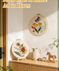Interior scene with finished Beginner Punch Needle Kit With Hoop Needle Yarn And Fabric Pattern Including Step By Step Video Guide All In One Grab And Go DIY Embroidery Set For Women And Teens Easy To Use Craft Gift displayed on a table and wall.