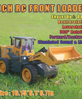 Dope One Fourteenth Scale RC Wheel Loader with nine channel remote on grass; liftable bucket, simulated sound and light, 360° turn.