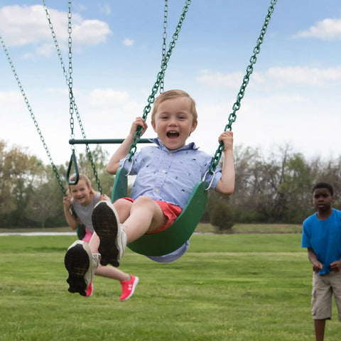 Kids playing on Big Brutus Galvanized Steel Swing Set Kit With Classic A Frame Two Belt Swings Trapeze Bar Easy Assembly