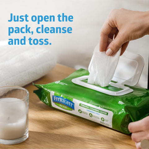 Hand pulling wipe from pack of Aloe Infused Adult Incontinence Cleansing Wipes, Large 8x10 Inches, Pack of 48, No Rinse Formula.
