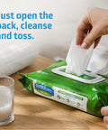 Hand pulling Aloe Based Personal Cleansing Wipes For Sensitive Skin, Scented, Large 8 By 10 Inch Incontinence Wipes from green pack