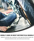 Close-up of person using pliers near motorcycle tire, illustrating 7 Piece Motorcycle Repair Tool Kit With Spanner Screwdriver Pliers Spark Plug.