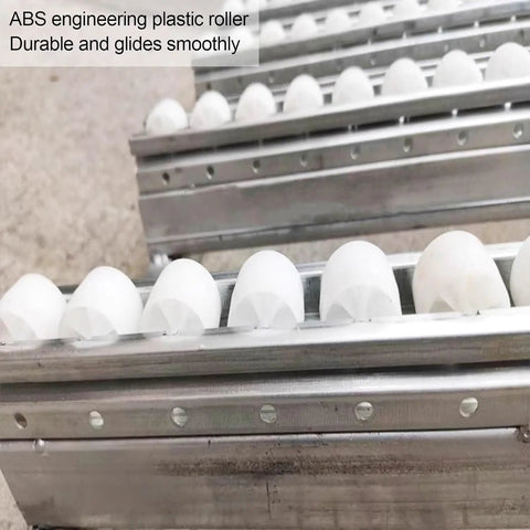 Smooth Rolling Gravity Roller Conveyor With Abs Plastic Wheels And Precision Bearings Unpowered Flow Track close-up of white ABS rollers.