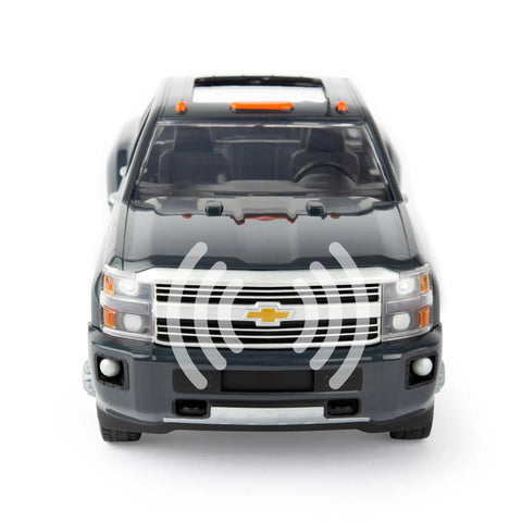 Front view of Chevy Silverado from John Deere 1:16 Scale Farm Construction Set With Skid Steer And Chevy Silverado Lights, Sounds And Barricades