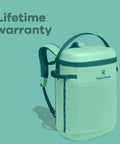 Carryout Cooler Backpack With All Day Cold Insulation And Portable Soft Build Trail And Park Friendly Features An Ergonomic Strap System 22 Liter Capacity In Shale Gray side view on teal background.