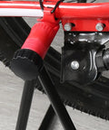 Close-up of a red bike wheel on the Garage Ready Vertical Triangle Bike Stand For Indoor Parking And Maintenance